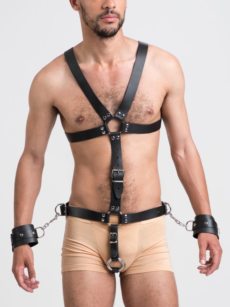 DOMINIX Deluxe Harness mit Penisring und Handfesseln
