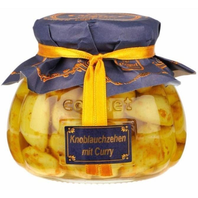 Knoblauchzehen mit Curry  in Öl und Essig