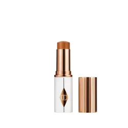 CHARLOTTE TILBURY - Unreal Skin Sheer Glow Tint - Feuchtigkeitsspendender Foundation-Stick, 8 g,  Tan